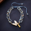 Grey moonstone geometric bracelet with butterfly woven hand rope for women.
