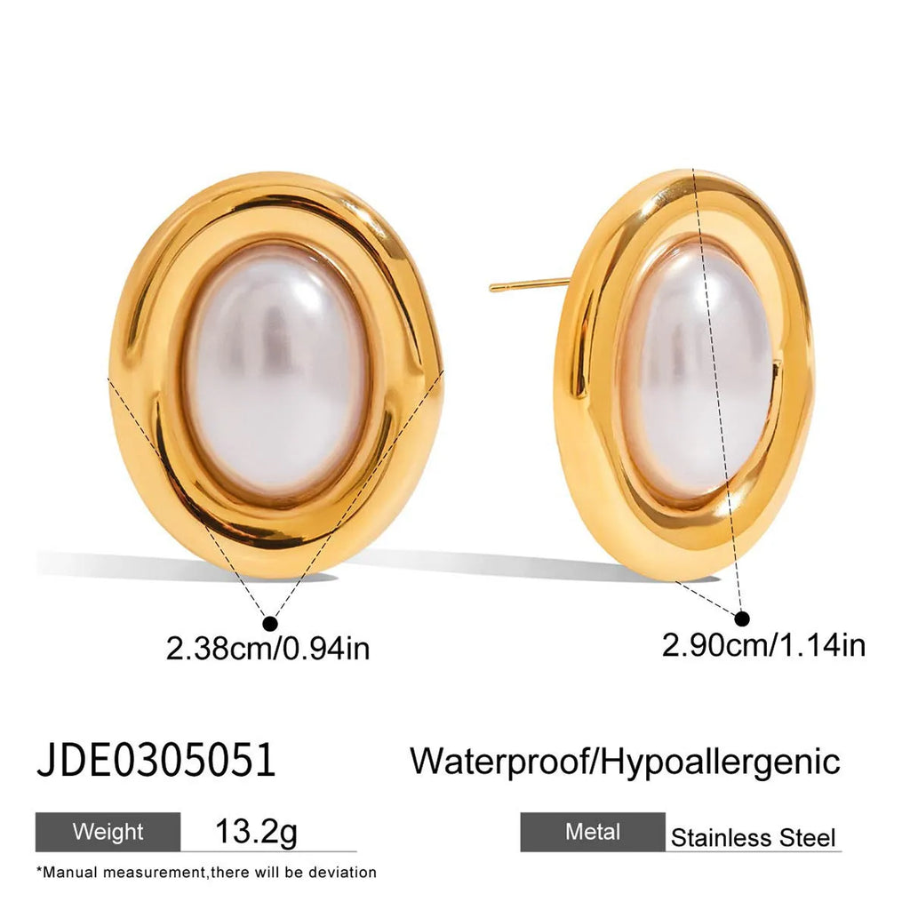 A pair of stainless steel vintage pearl ball stud earrings with surgical steel posts on a white background.