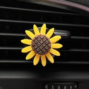 Yellow sunflower car vent perfume clip measuring 8cm with secure mounting clip for air freshening