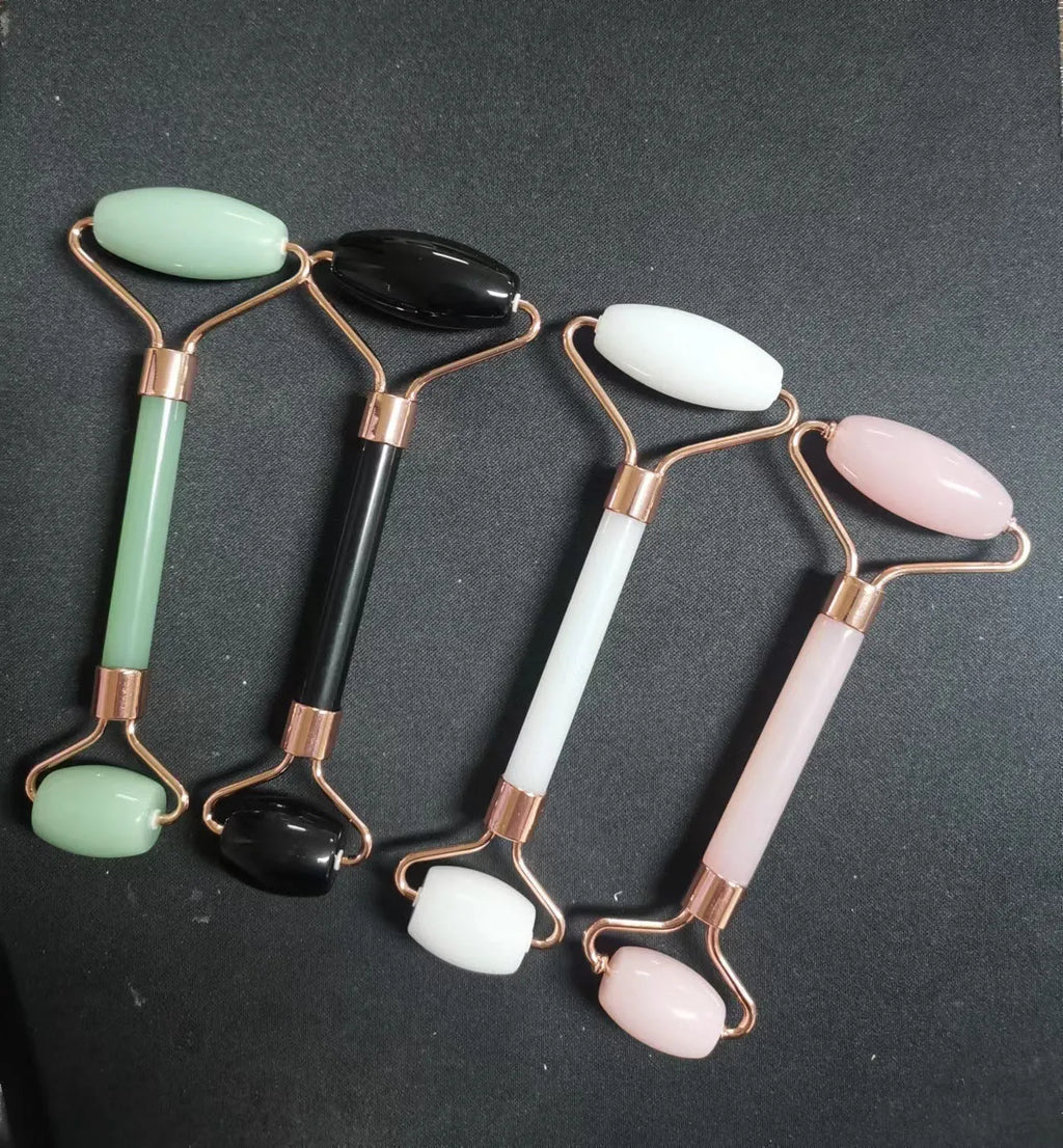 Scraping roll massager set with pink double-headed roller and scraping board for facial muscle relaxation