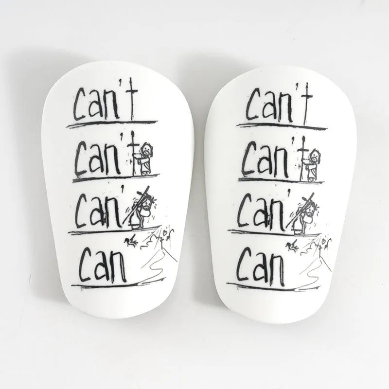 A pair of white PU football shin guards for adult training, showing the strap and protective shell.