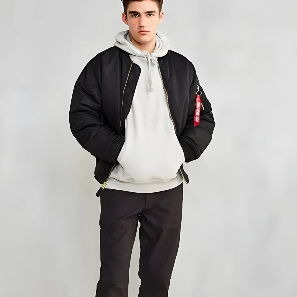 Men's loose fit nylon pilot jacket in Army Green shown on a hanger.