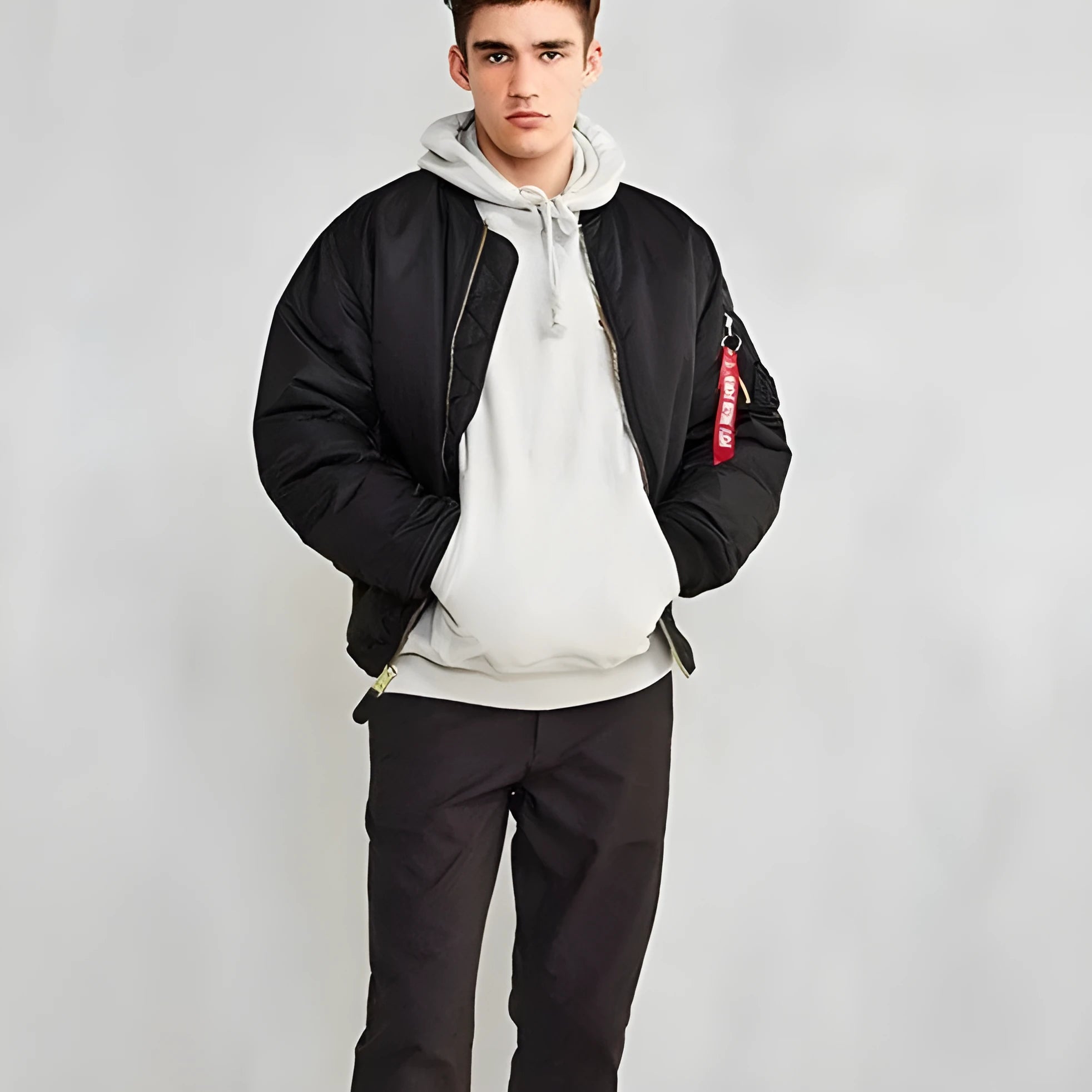 Men's loose fit nylon pilot jacket in Army Green shown on a hanger.