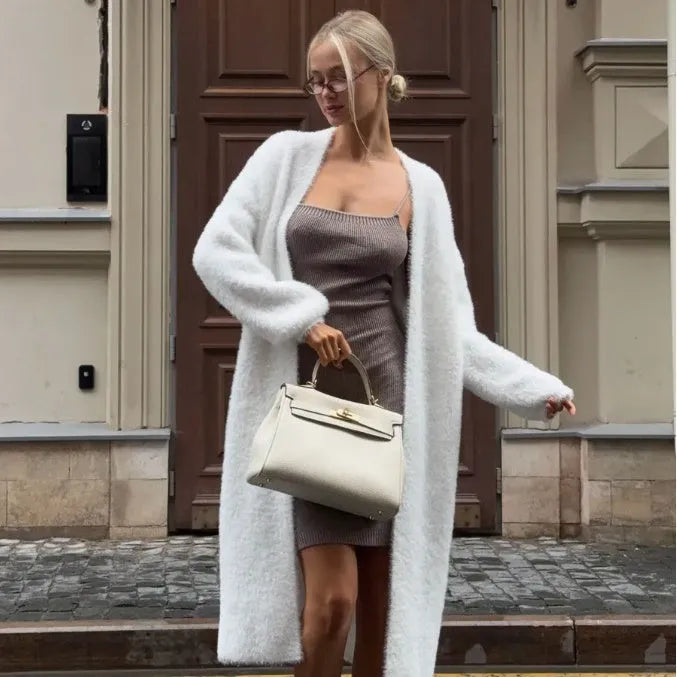 White thick-knit women's cardigan jacket with long sleeves, shown open as a loose-fitting layer.
