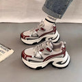 Women's Red and Silver clunky platform sneakers with mesh lining and rubber sole on a white background.