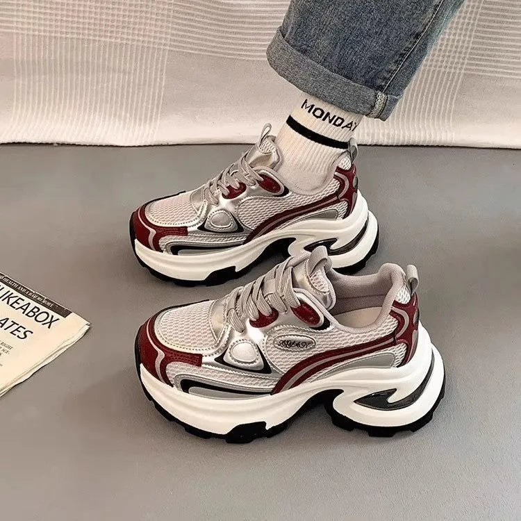 Women's Red and Silver clunky platform sneakers with mesh lining and rubber sole on a white background.