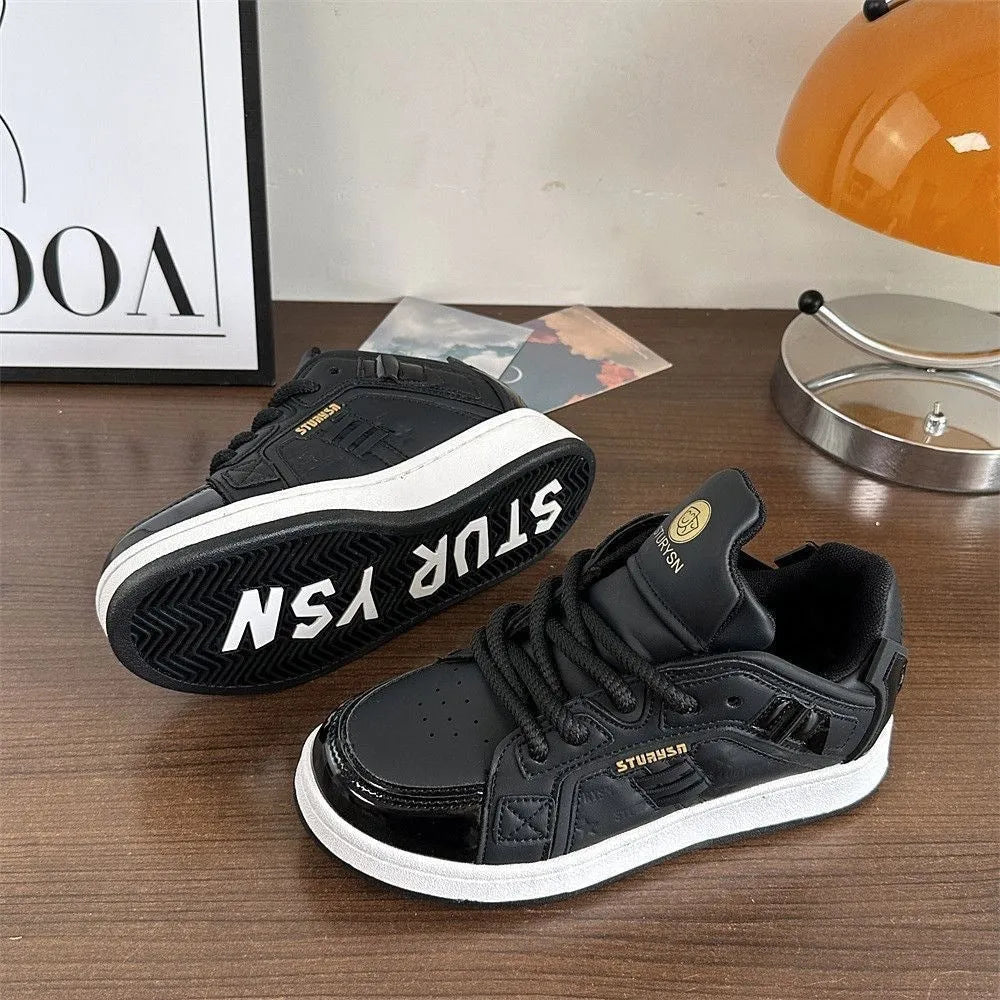 Men's black thick bottom board shoes with PU leather upper and rubber sole on a light background