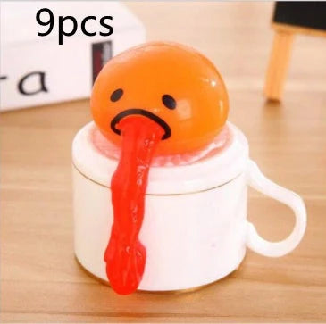 Gudetama Vomiting Egg Toy in green, orange, pink, and yellow