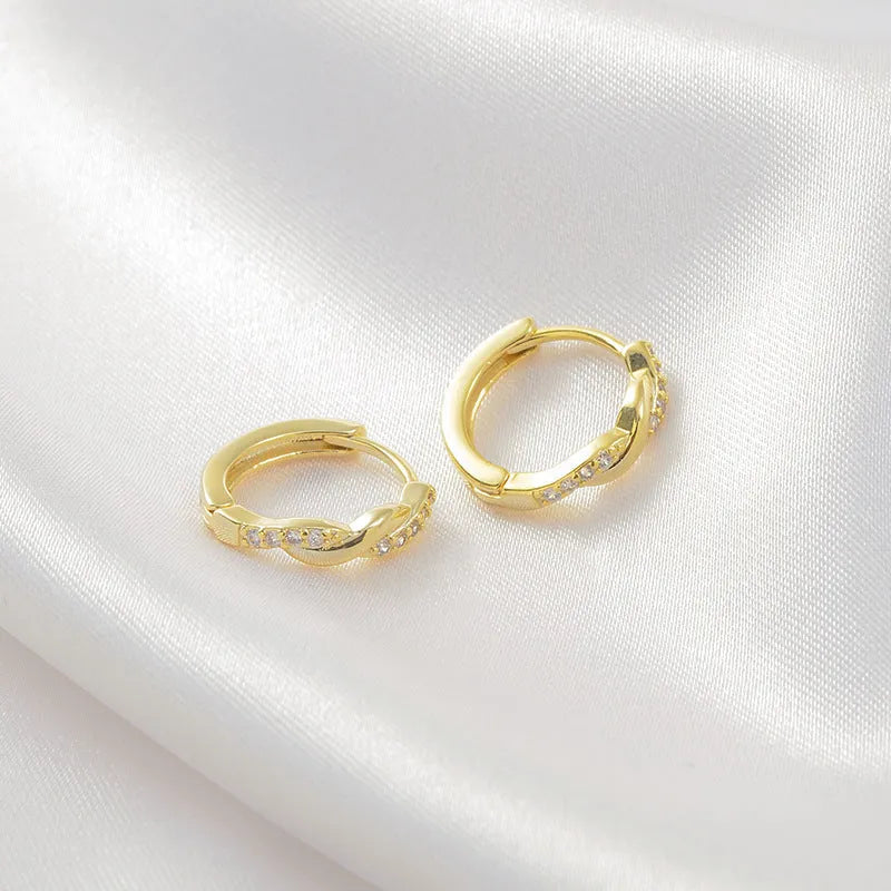 Gold and silver geometry-shaped interwoven hemp rope earclip earrings for women.