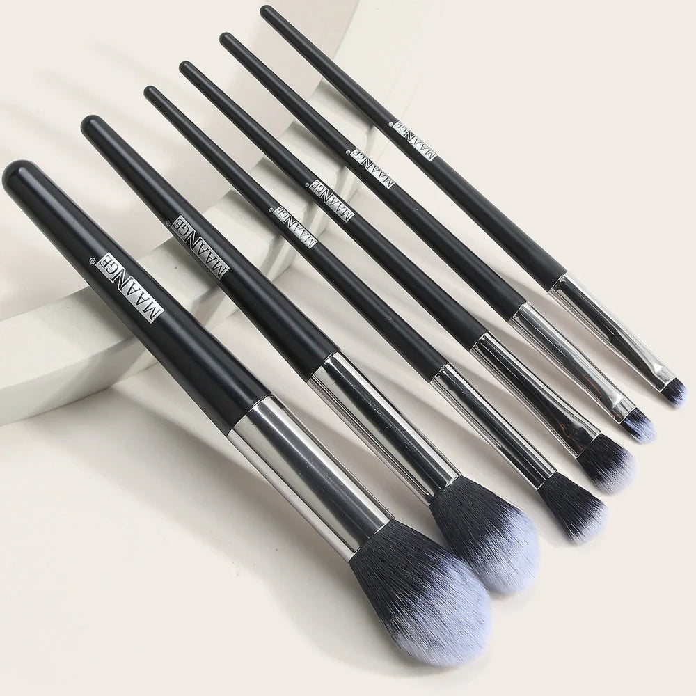 Six makeup brushes with black synthetic bristles and natural wood handles measuring 15cm