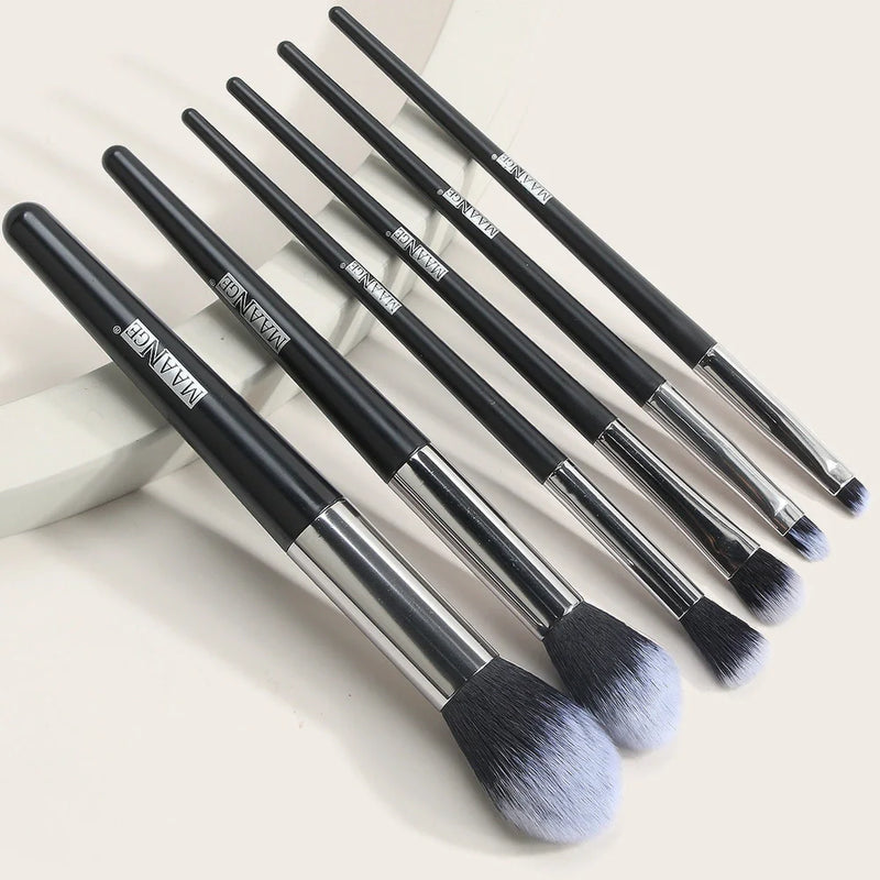 6-piece makeup brush set with synthetic fibre bristles offering precise powder application and natural wood handles measuring 15cm for comfortable grip during professional or home use
