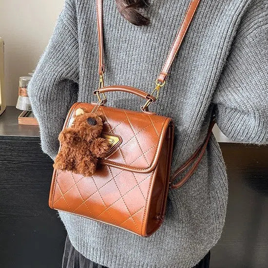 Mini PU backpack in brown with stitching design and a pendant option