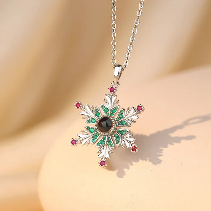 Shimmering snowflake necklace with projection of festive colors or Christmas languages