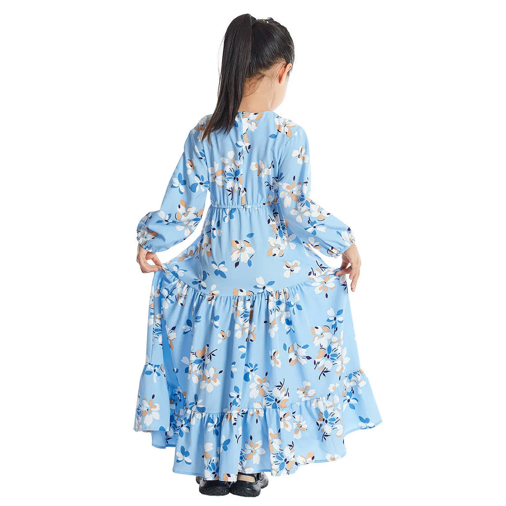 Girl wearing a long sleeve floral polyester dress with a flounced skirt in beige, available in heights 100-160cm