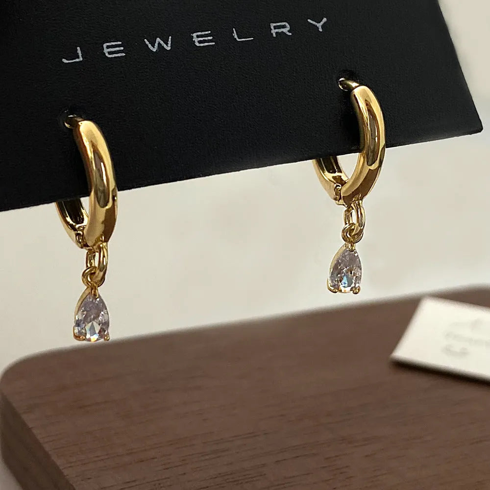 Women's zircon necklace, earrings, and anklet set with geometric meteor shower design.