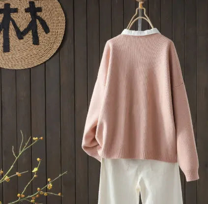 Long-sleeved knitted cardigan with button pocket, solid colour queen style, available in apricot, blue, and pink