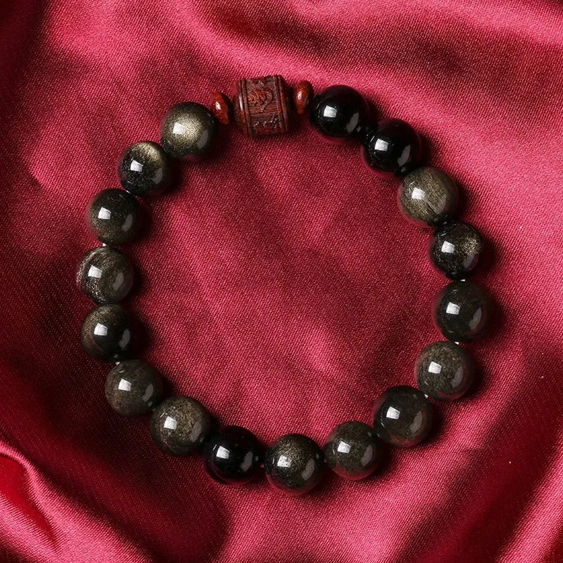 Hand-woven unisex bracelet with round 10mm golden obsidian beads in a vintage style.