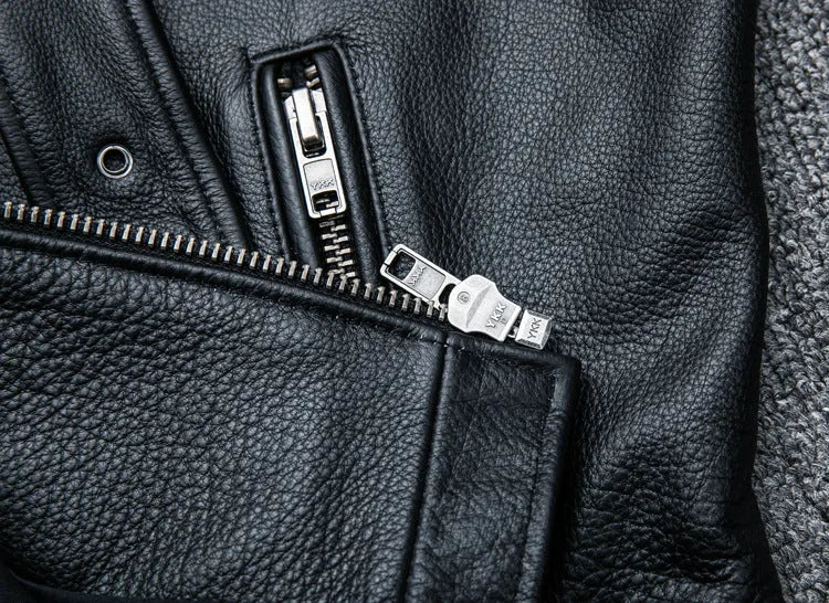 Pure cowhide biker's leather jacket in black with front zip and snap collar, full-length sleeves, polyester lining