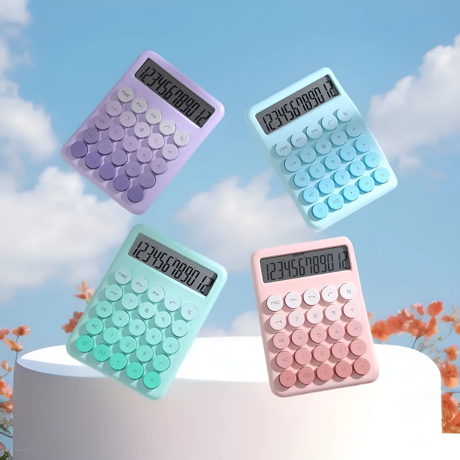 Desktop calculator with gradient colour finish in violet, blue, mint, or pink on a desk.