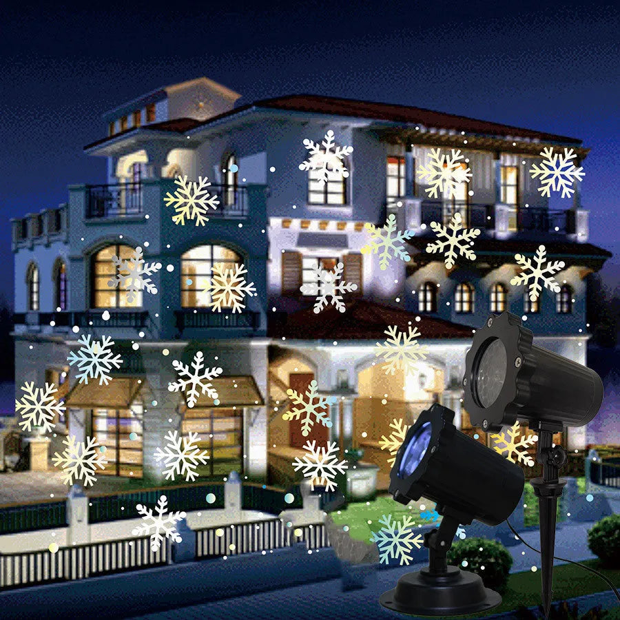 LED Christmas snowflake laser projector with white snowfall pattern on a garden lawn at night