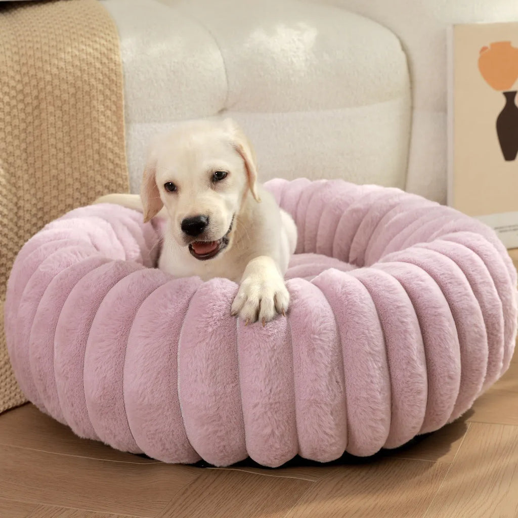 Round long-haired plush pet bed for dogs and cats, shown in beige, with size chart showing S, M, L, XL, XXL, XXXL options.