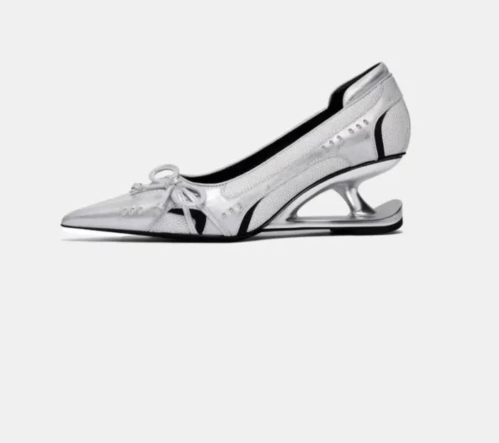 Black women's pointed toe Mary Jane shoes with a floating special-shaped heel on a white background.