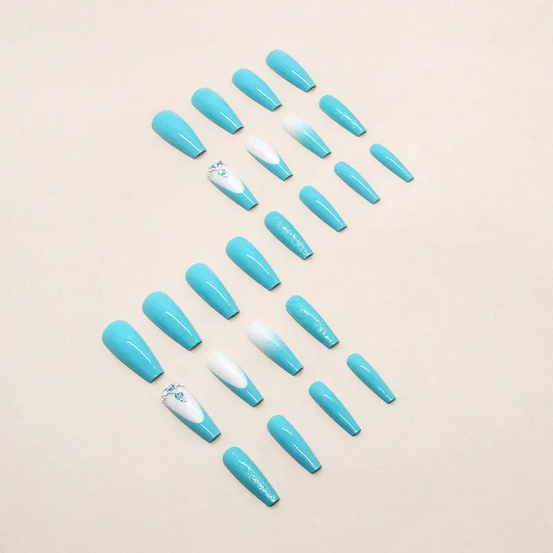 Solid colour artificial nails with smart blue diamond accents and ballet-length cut
