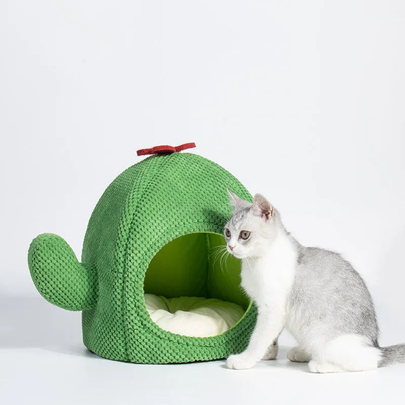 Green enclosed cat cave bed for kittens and small dogs, showing cosy interior.