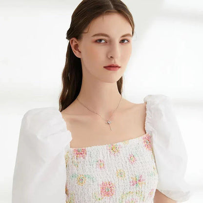 Sparkling Cupid heart necklace with fluttering angel wings, made of titanium steel and zircon crystals