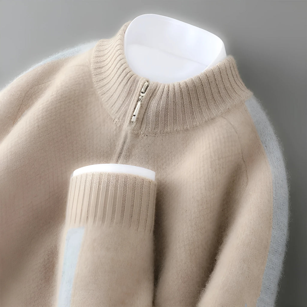 Plus-size model wearing a slim-fit, grey, half-zip wool sweater with a round neckline.