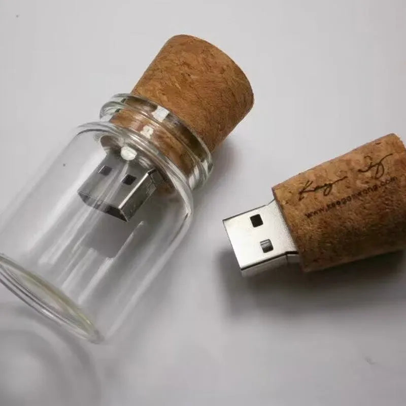 Transparent plastic bottle-shaped USB flash drive with a wooden ship model inside.