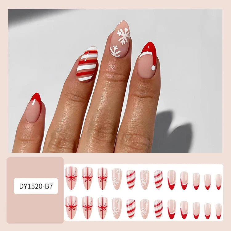 Christmas false nails with festive hat, striped, and snowflake designs for holiday parties