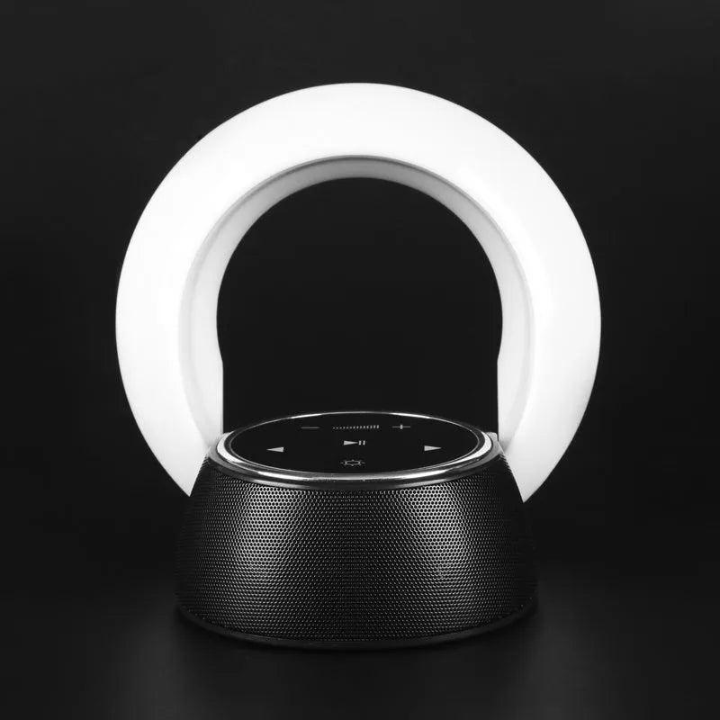 DEAMAK-1 Bluetooth speaker and LED desk lamp in folded position showing touch controls.