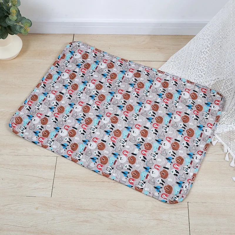 Reusable waterproof pet training pad with animal print design on a wooden floor