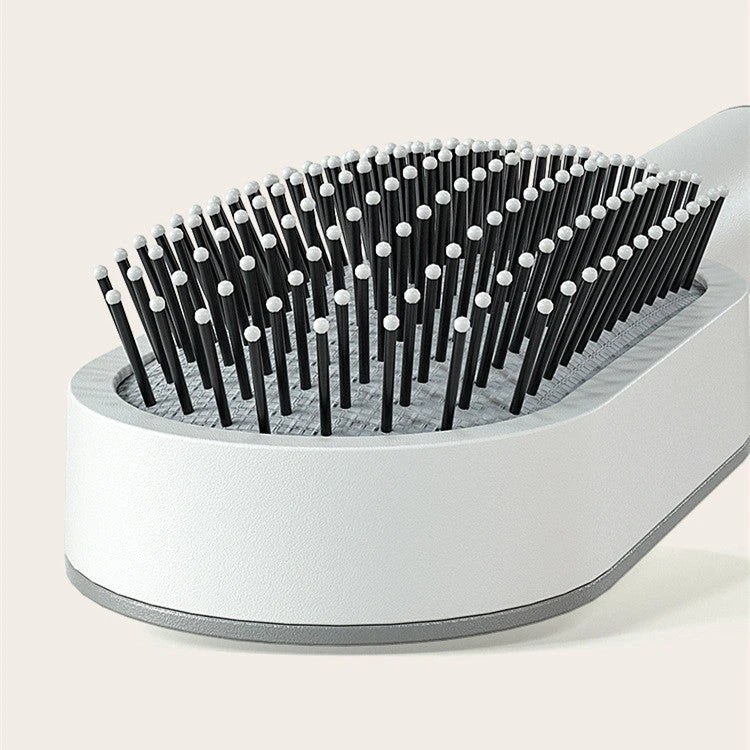 3D Air Cushion Hair Brush in elegant white, showcasing wide comb teeth and ergonomic handle
