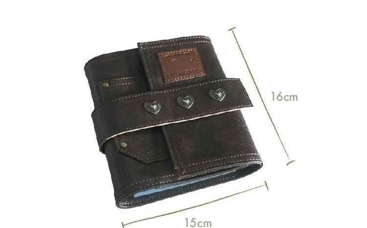 Brown A7 notebook with a leather buckle closure on a PU cover, showing loose-leaf binding