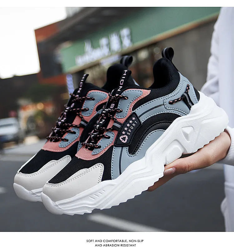 White women's casual sneaker with mesh upper, thick PU sole, buckle detail, and round toe.