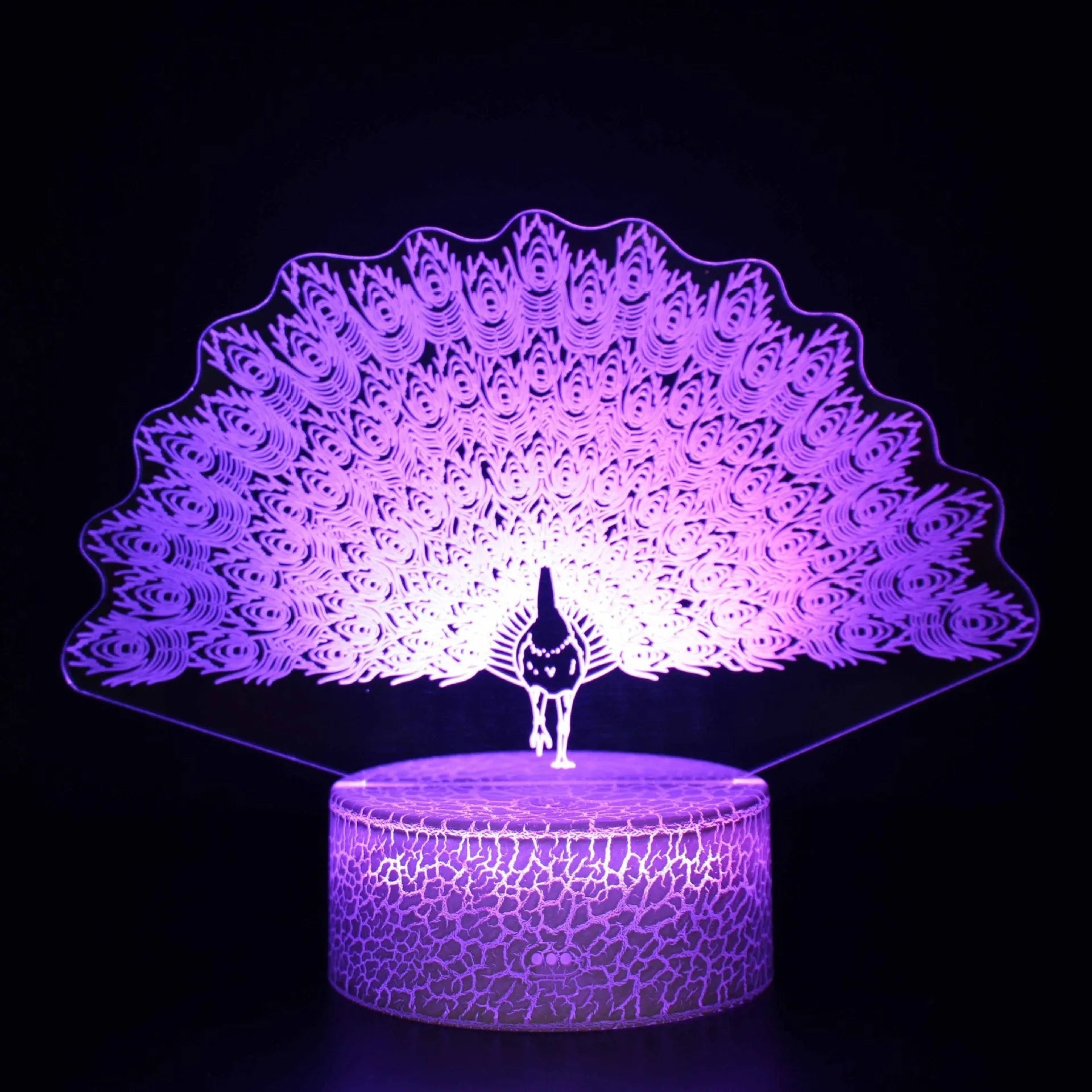Acrylic USB touch night light with colourful crack base design on a bedside table.