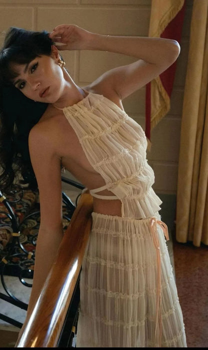 Stylish women's beach dress suit featuring a halter top and pleated skirt, perfect for summer outings.