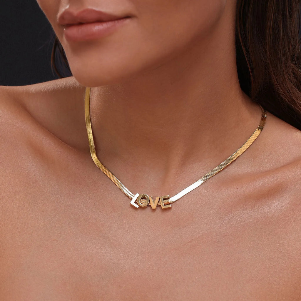 Gold titanium steel necklace with letter A charm on a 40.5cm blade chain
