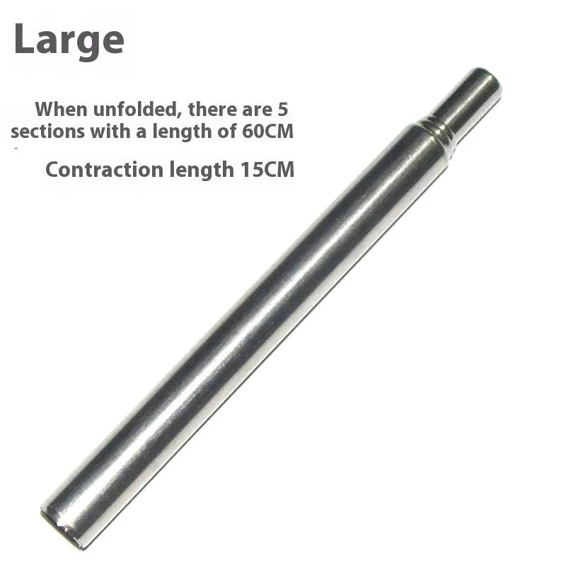 Stainless steel outdoor fire blowing stick on a picnic table with camping gear