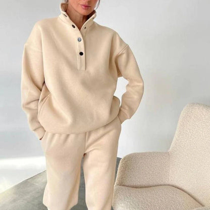 Cozy pullover and pant set in neutral colors, featuring a relaxed, oversized fit and warm hoodie design for ultimate comfort and style.