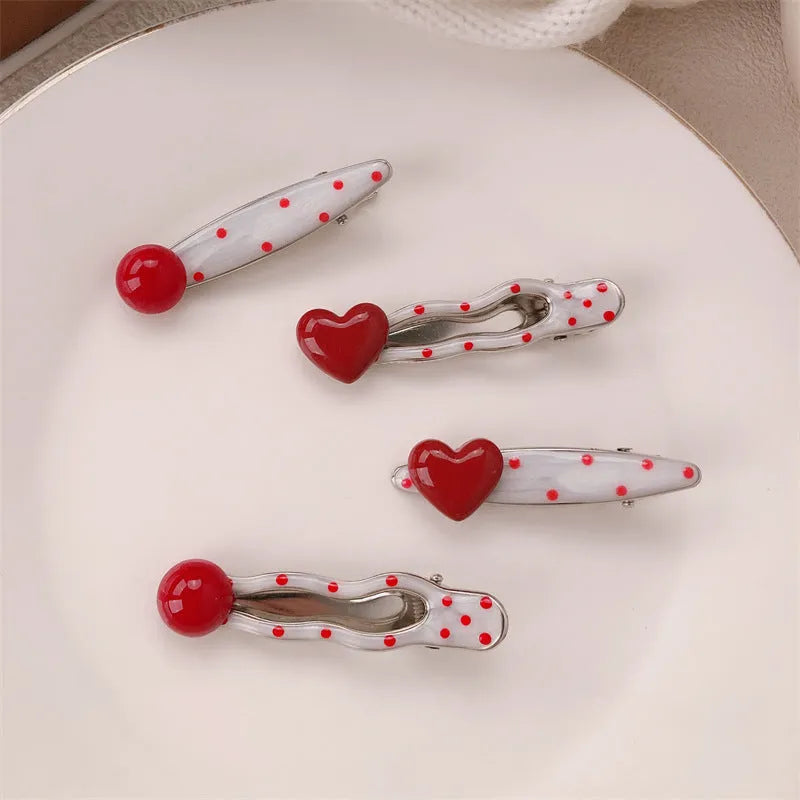 Red stereo love heart-shaped hair clip with French retro dots and willow leaf design.