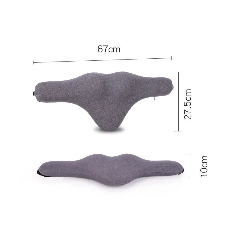 Dark gray memory foam car neck pillow on a car headrest.