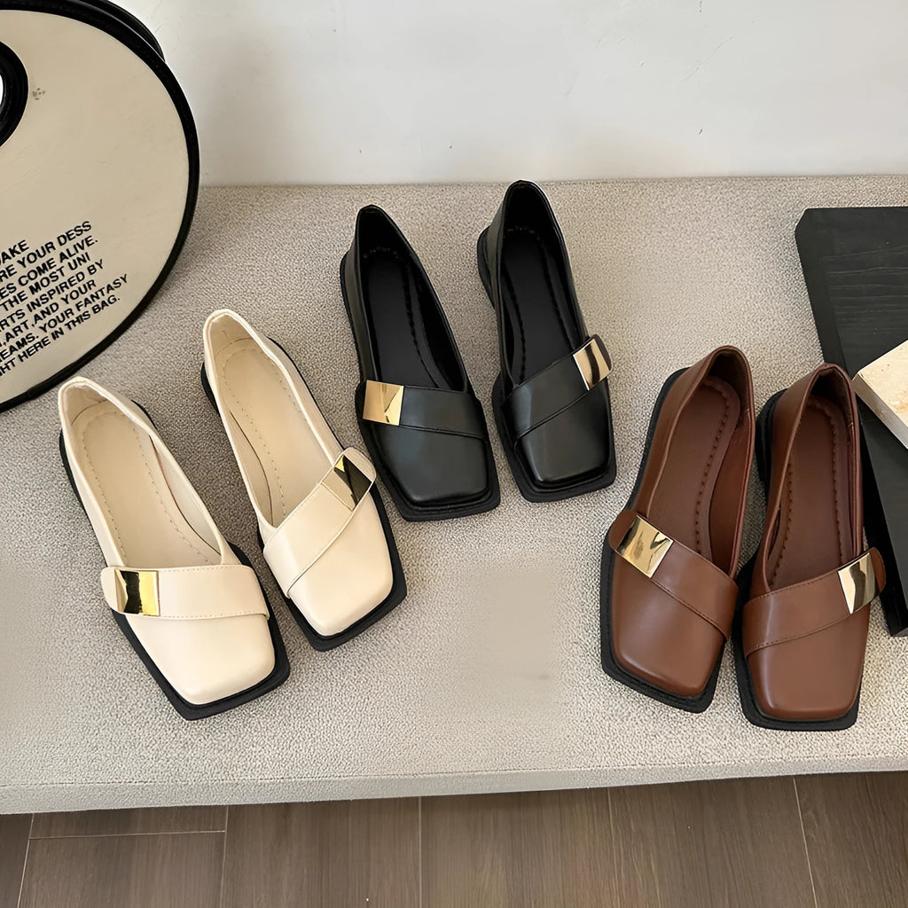 Beige women's square toe flat slip-on shoes with a metal buckle and low square heel.