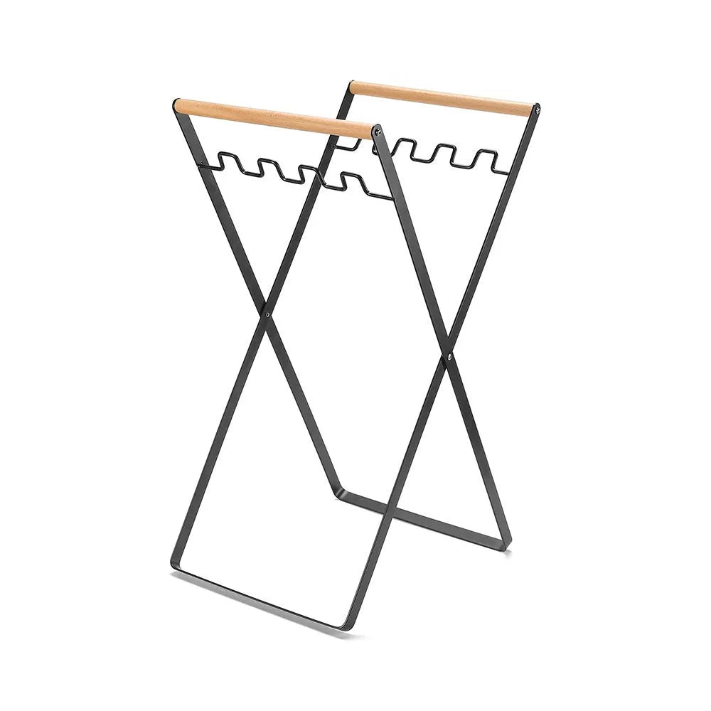 Foldable outdoor garbage storage hanger with iron frame and wooden handle in black colour.