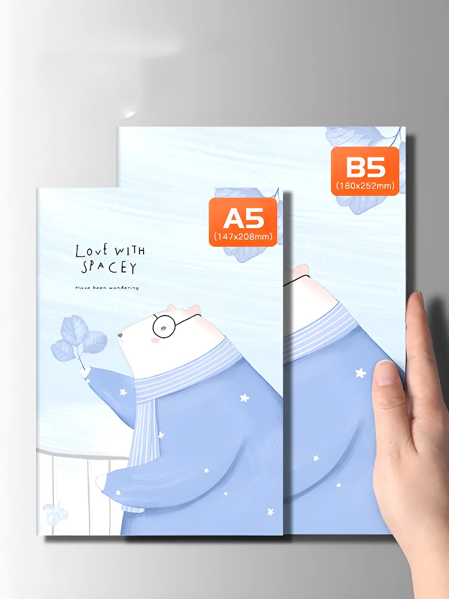 Set of 10 thread-bound A5 notebooks with kraft paper covers showing bear and sakura designs