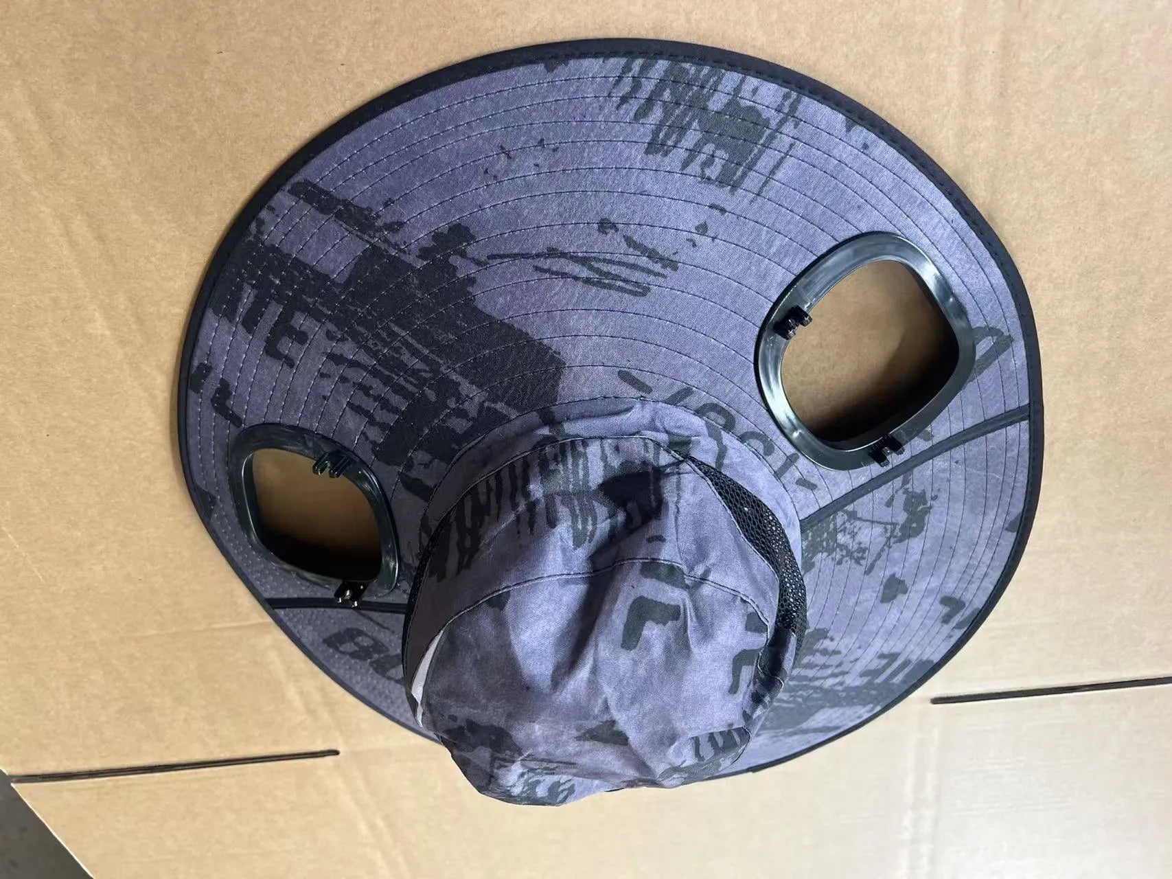 Men's grey solar powered cooling fan cap with large front eave and integrated fan unit