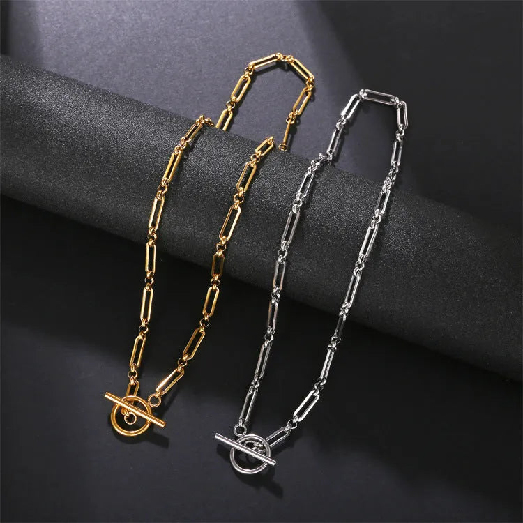 Stainless steel Chopin chain necklace and bracelet set in gold finish on white background