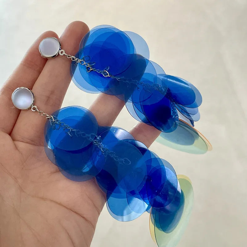 Gradient blue hand-woven long fringe earrings with artificial crystal and sterling silver needle on white background